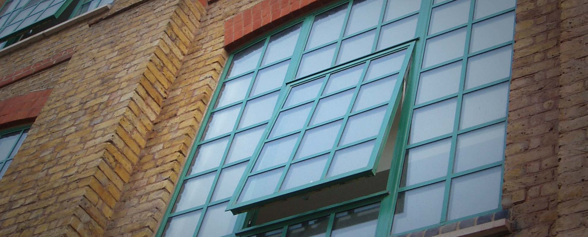 Green steel look windows for old factory refurbishment project